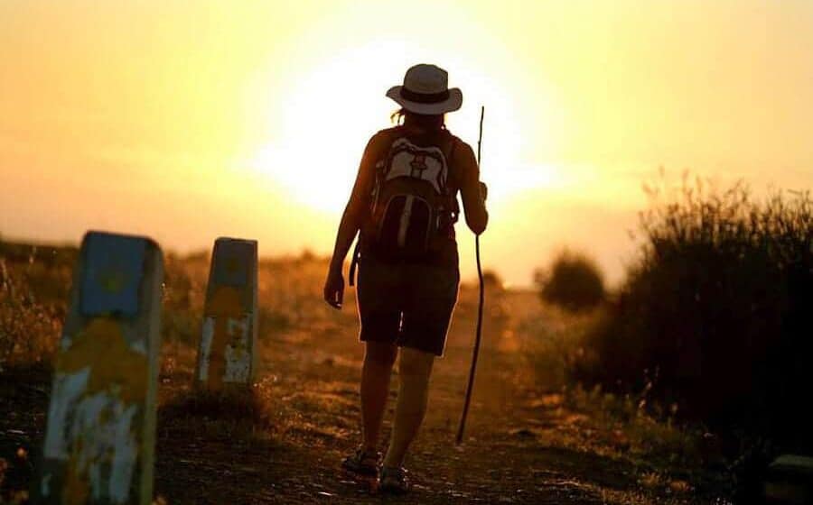 walking alone into the sunset with the arrow on the marker