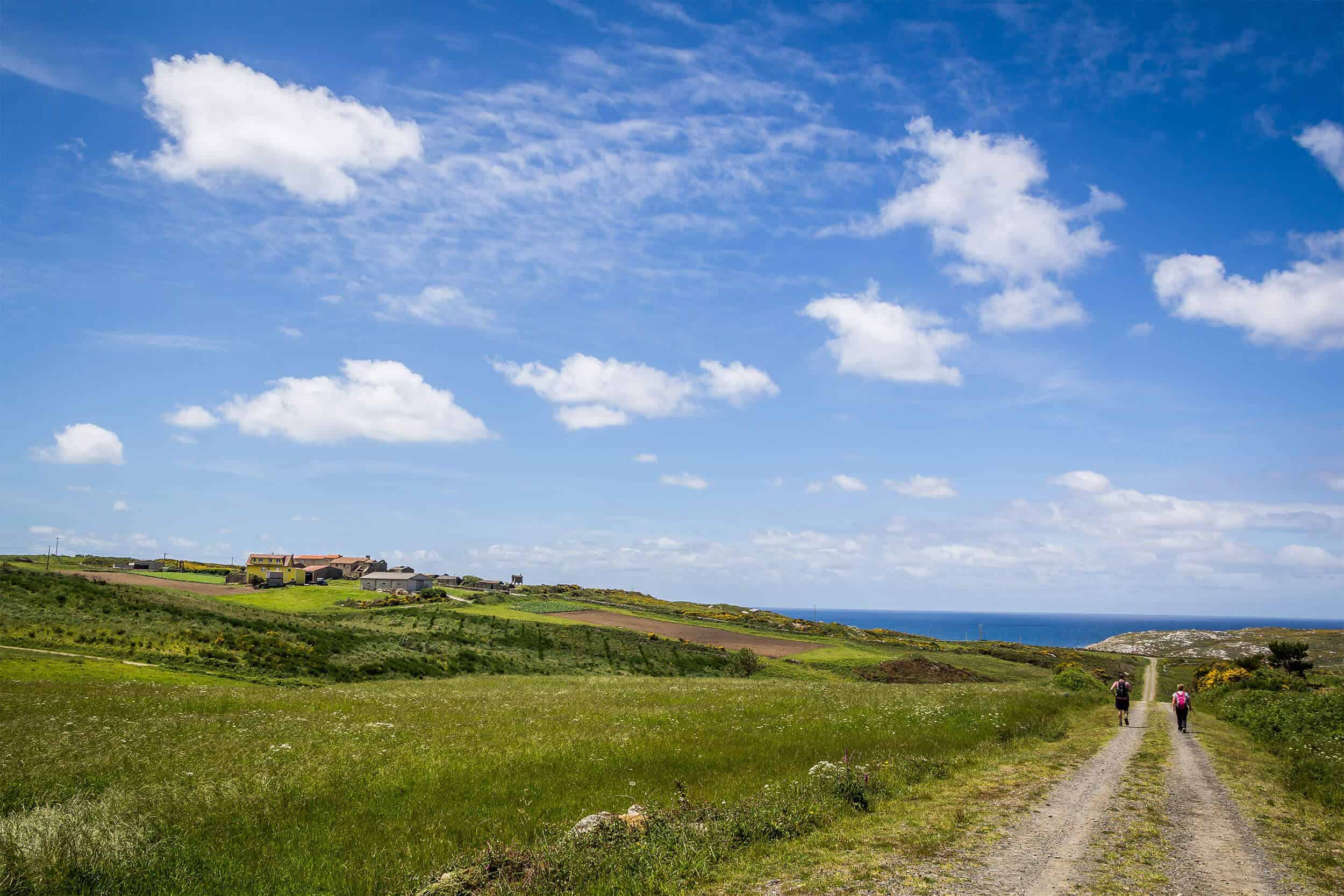 Pilgrim walking camino finisterra - end of the world toward sea