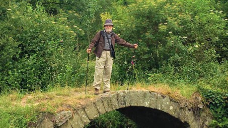 Pilgrim posing on the bridge - Camino