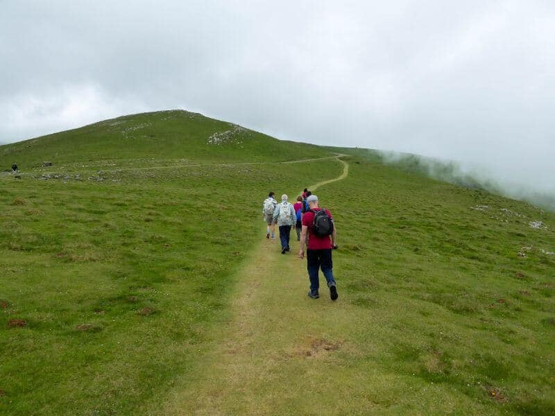 pilgrim walking the Camino Pyrenes hills