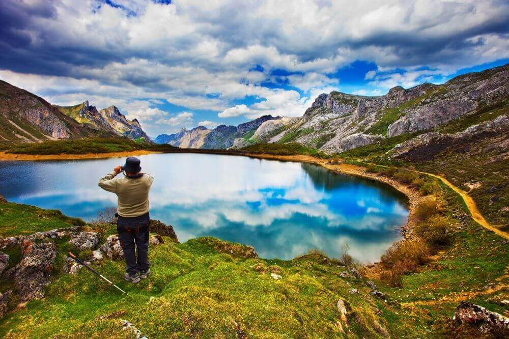 a picture of a pilgrim watching a lake