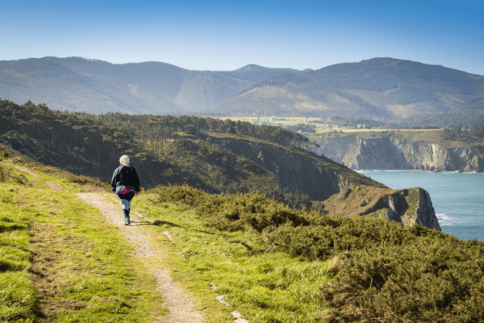 Woman walking the Camino in Asturias