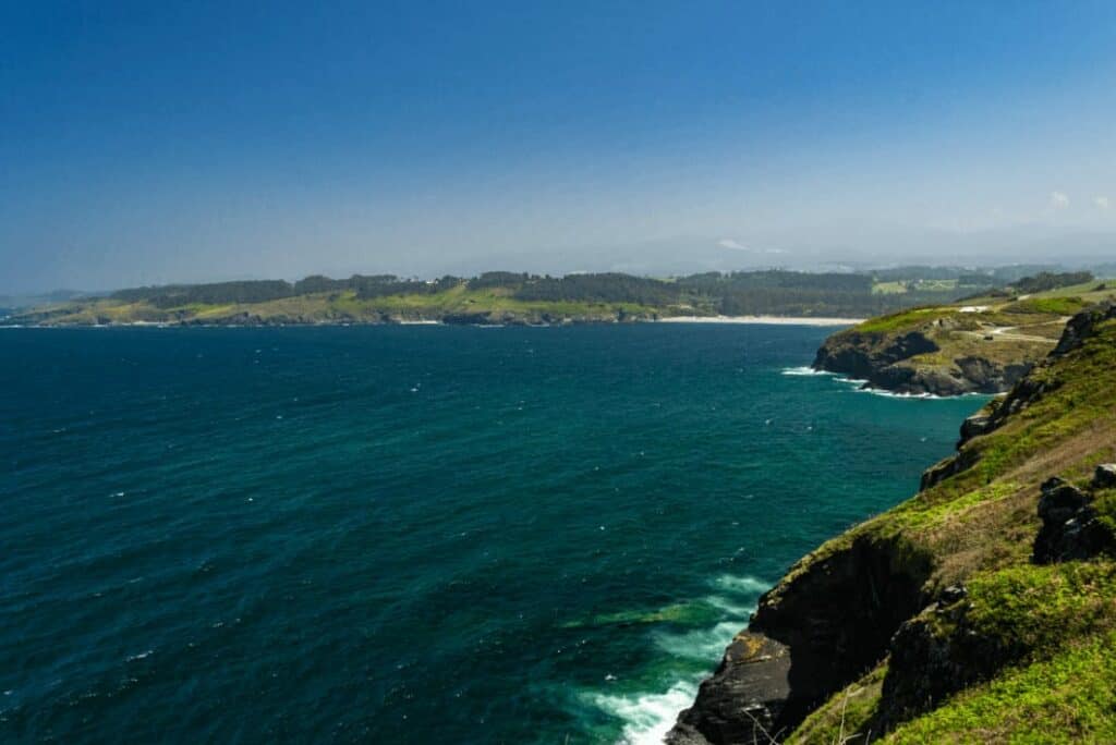 a picture of a sea and cliffs