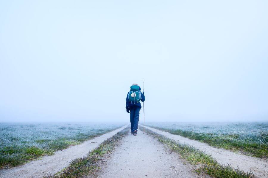 a picture of a pilgrim walking a path