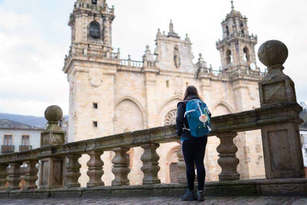 the cathedral in Santiago with a young pilgrim