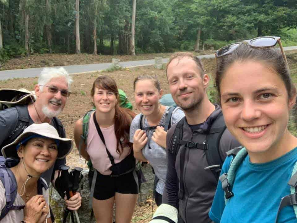 a picture of a group of pilgrims on their way to the forest