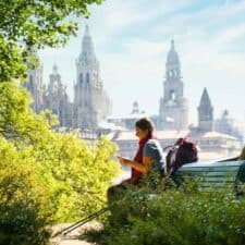 a picture of a pilgrim sitting in front of the cathedral