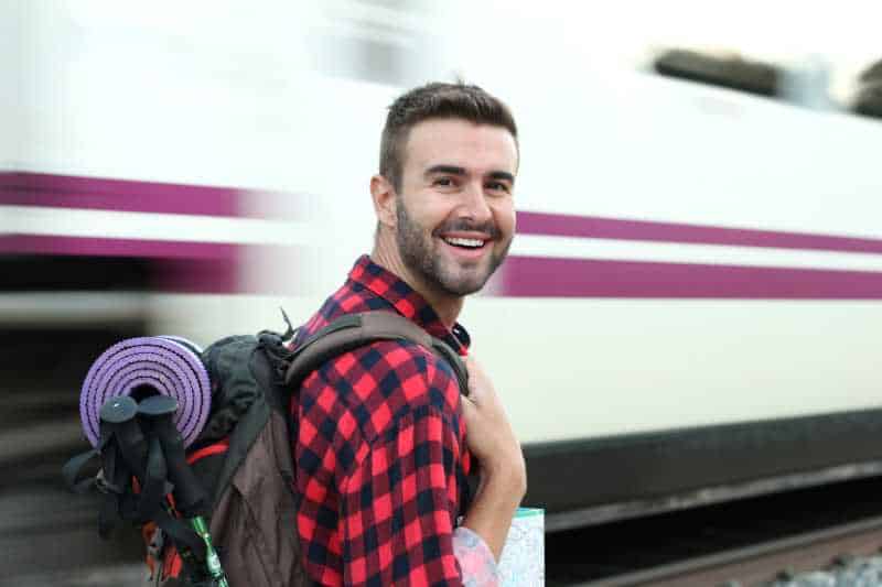 pilgrim catches train public transport to the Camino