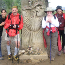 Group of pilgrims in front of monument